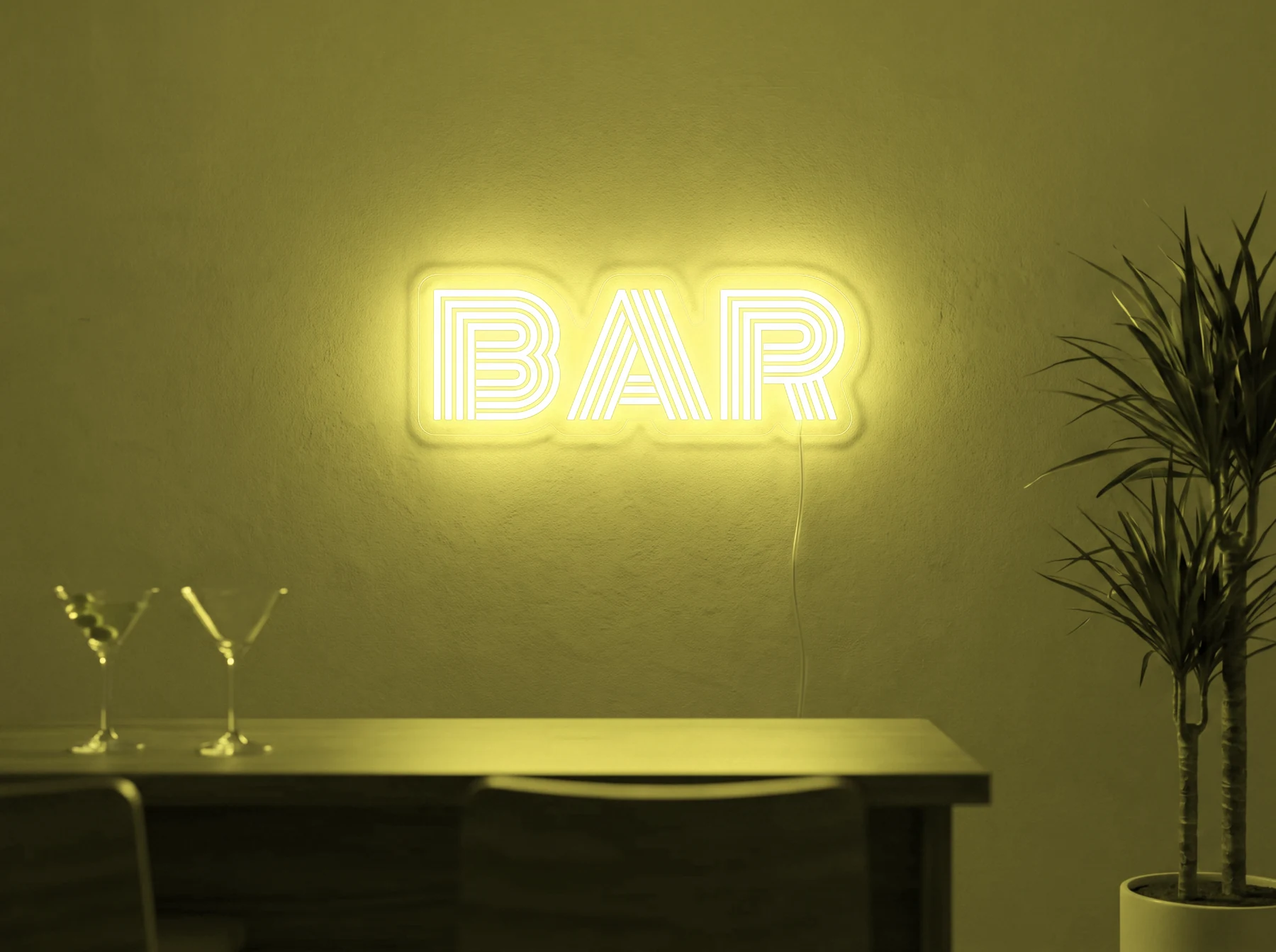 Neonskylt «BAR» i gul LED-neon, monterad på vägg