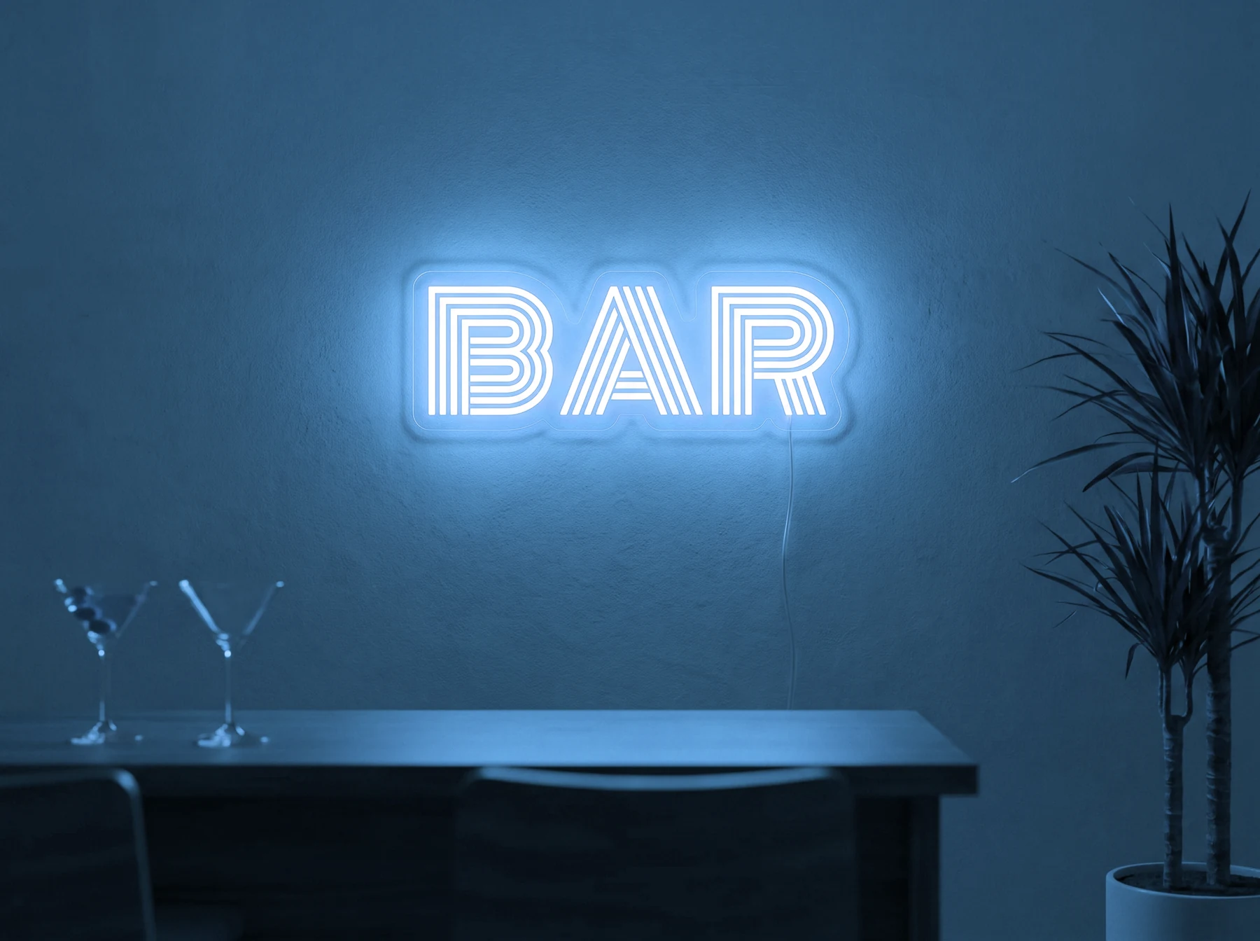 Neonskylt «BAR» i isblå LED-neon, monterad på vägg