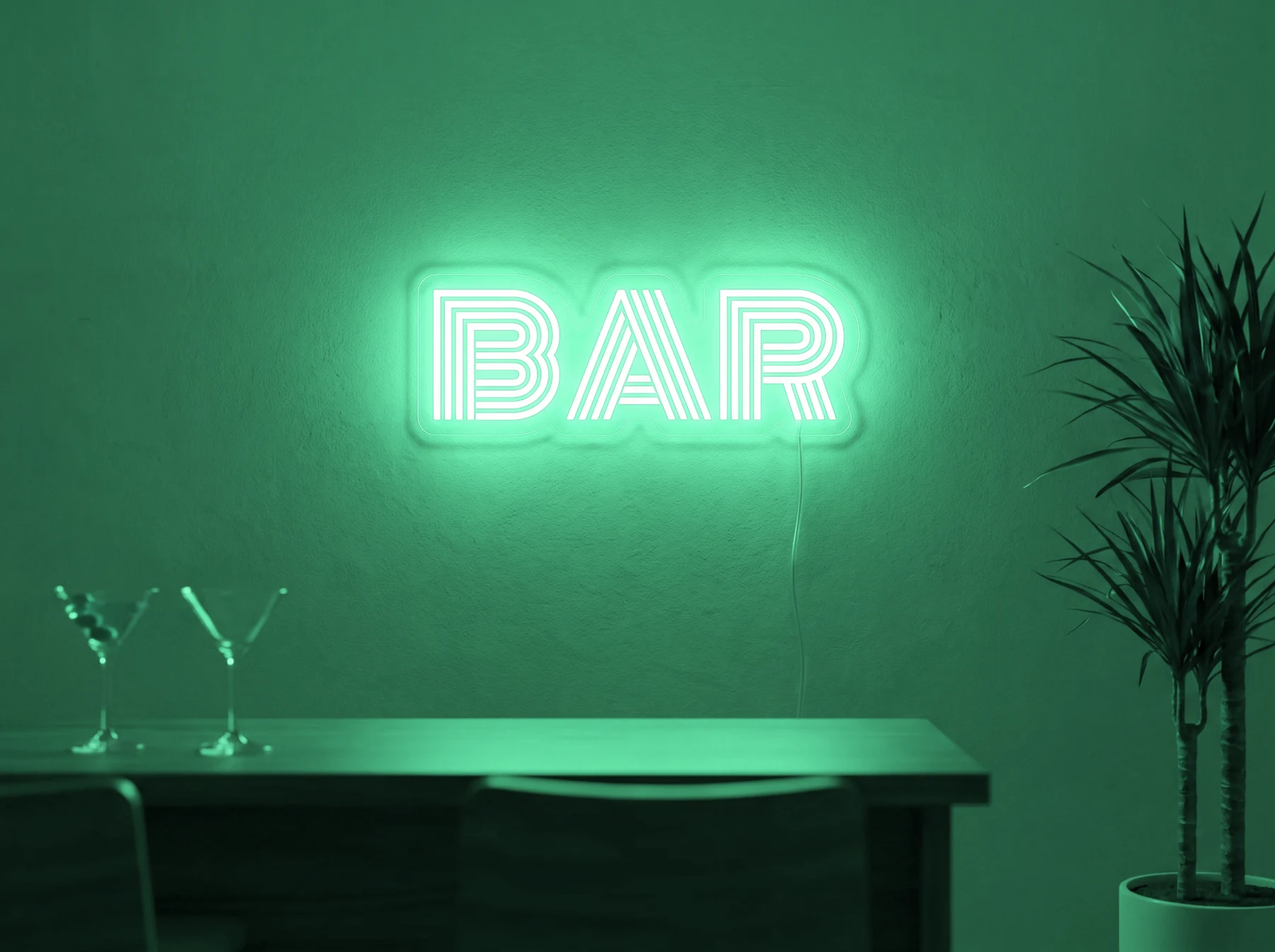 Neonskylt «BAR» i mintgrön LED-neon, monterad på vägg