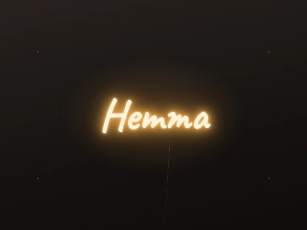 Neonskylt «Hemma» — monterad på vägg, med ljusringen bakom