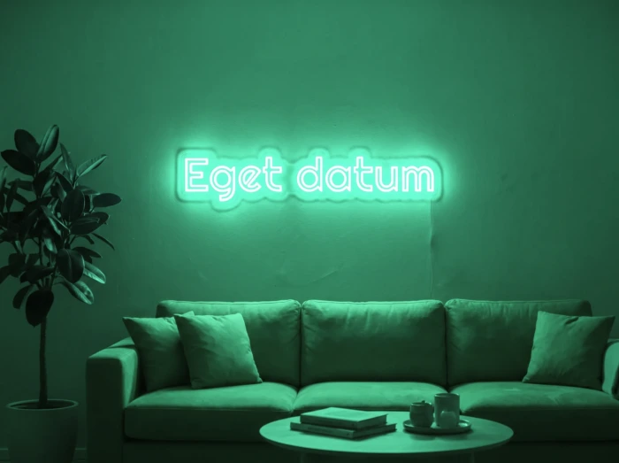 Neonskylt «Eget datum» i mintgrön LED-neon, monterad på vägg