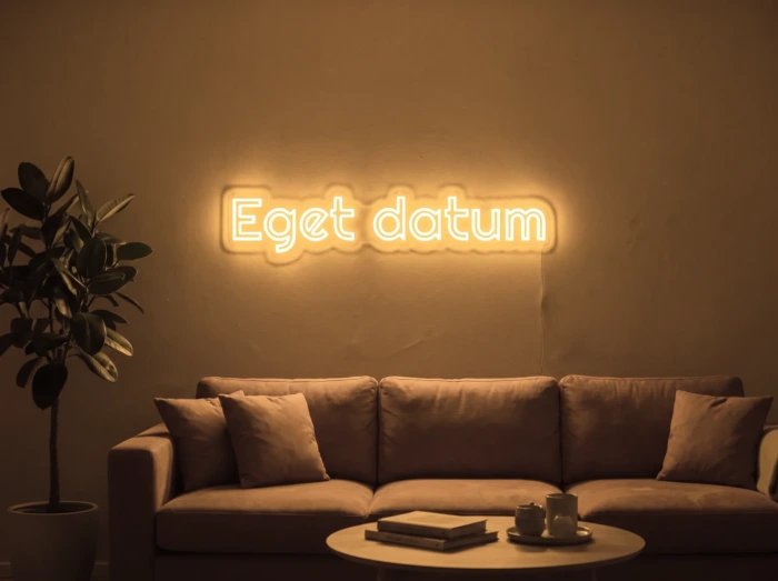 Neonskylt «Eget datum» i orange LED-neon, monterad på vägg