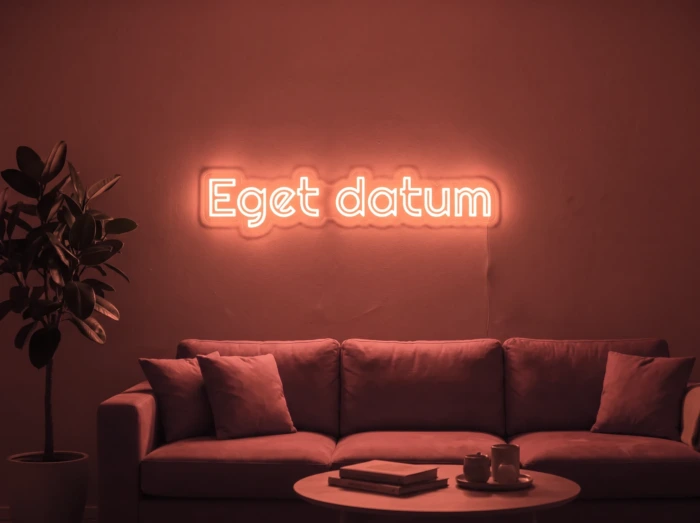 Neonskylt «Eget datum» i röd LED-neon, monterad på vägg
