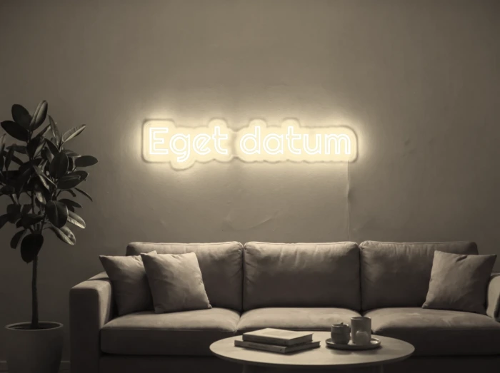 Neonskylt «Eget datum» i varmvit LED-neon, monterad på vägg