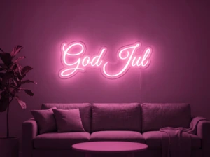 Neonskylt «God Jul» i rosa LED-neon, monterad på vägg