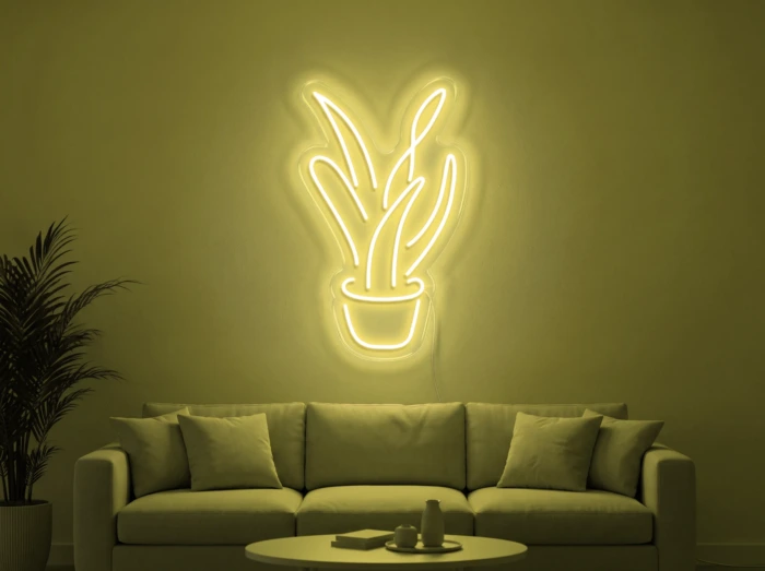 Neonskylt «Aloe vera» i gul LED-neon, monterad på vägg