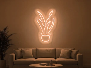Neonskylt «Aloe vera» i orange LED-neon, monterad på vägg