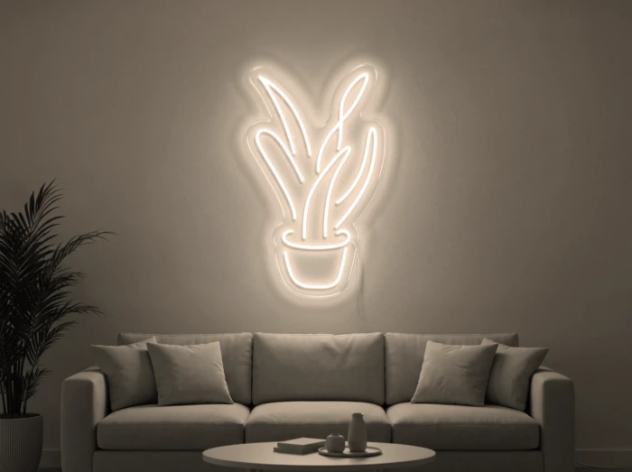 Neonskylt «Aloe vera» i varmvit LED-neon, monterad på vägg