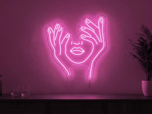 Neonskylt «Ansikte med händer» i rosa LED-neon, monterad på vägg