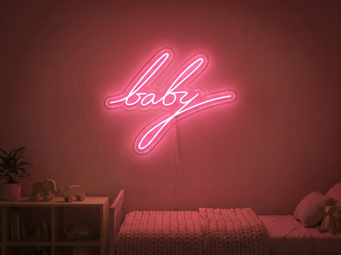 Neonskylt «Baby» i röd LED-neon, monterad på vägg