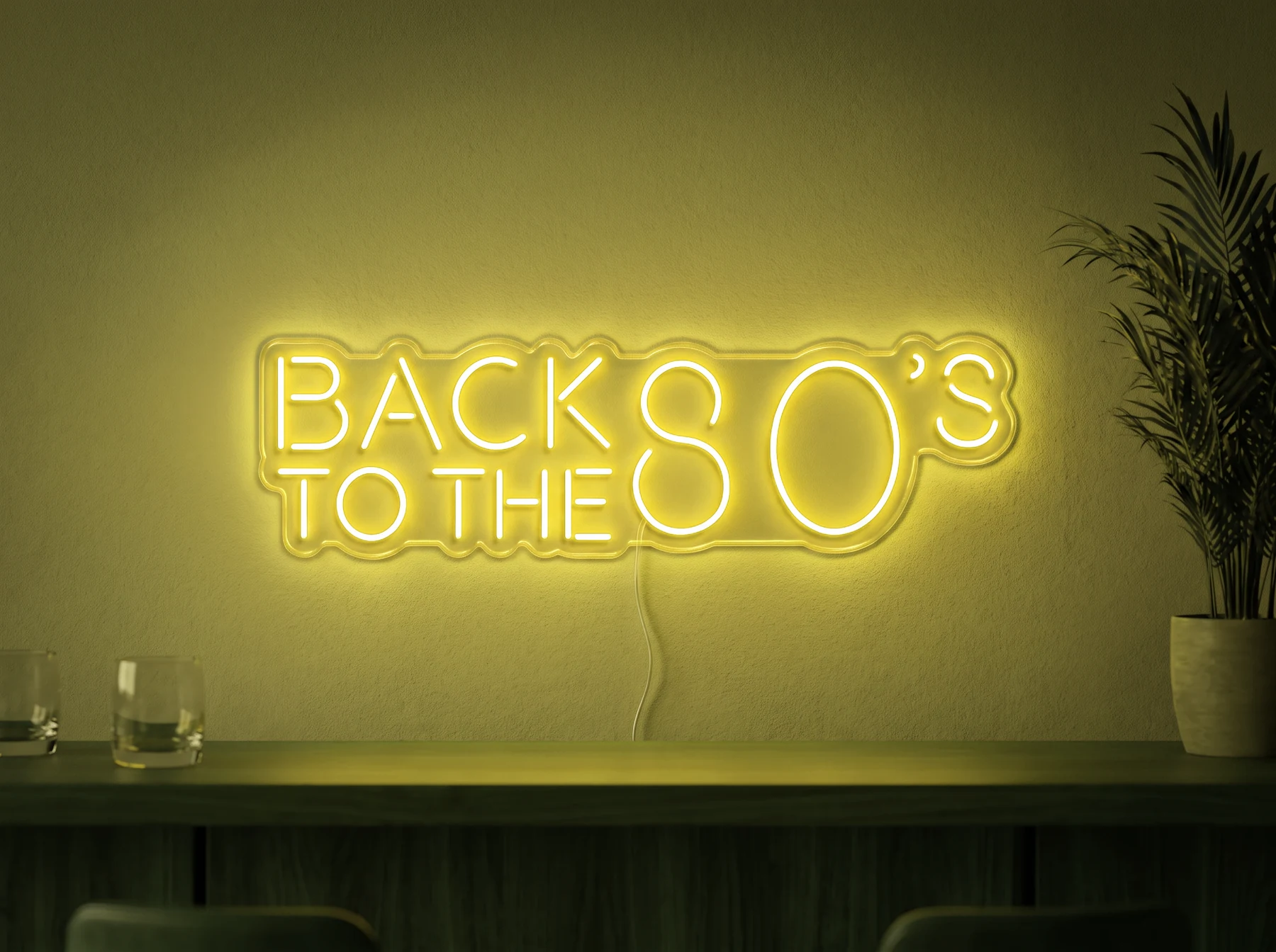 Neonskylt «Back to the 80s» i gul LED-neon, monterad på vägg
