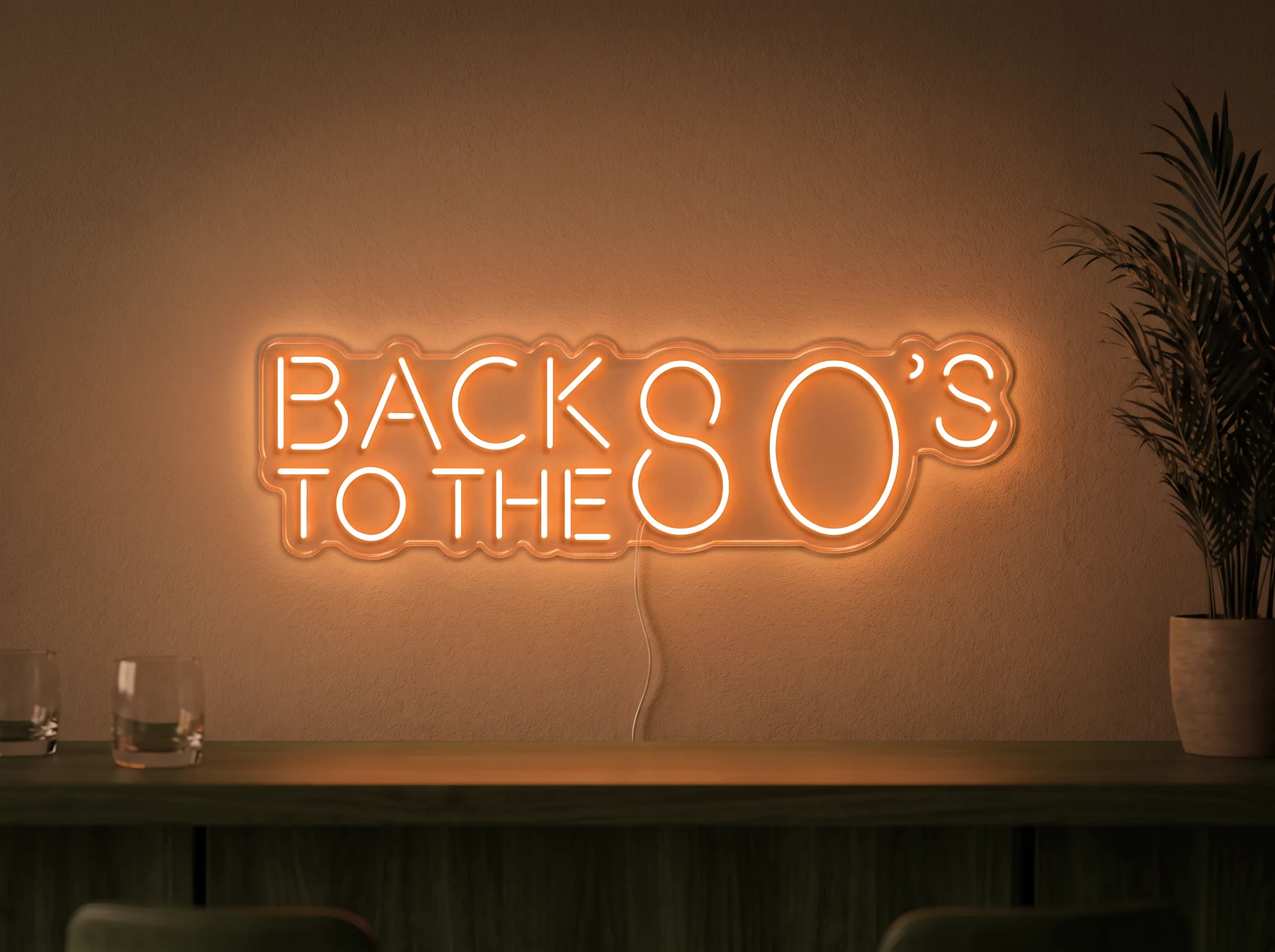 Neonskylt «Back to the 80s» i orange LED-neon, monterad på vägg