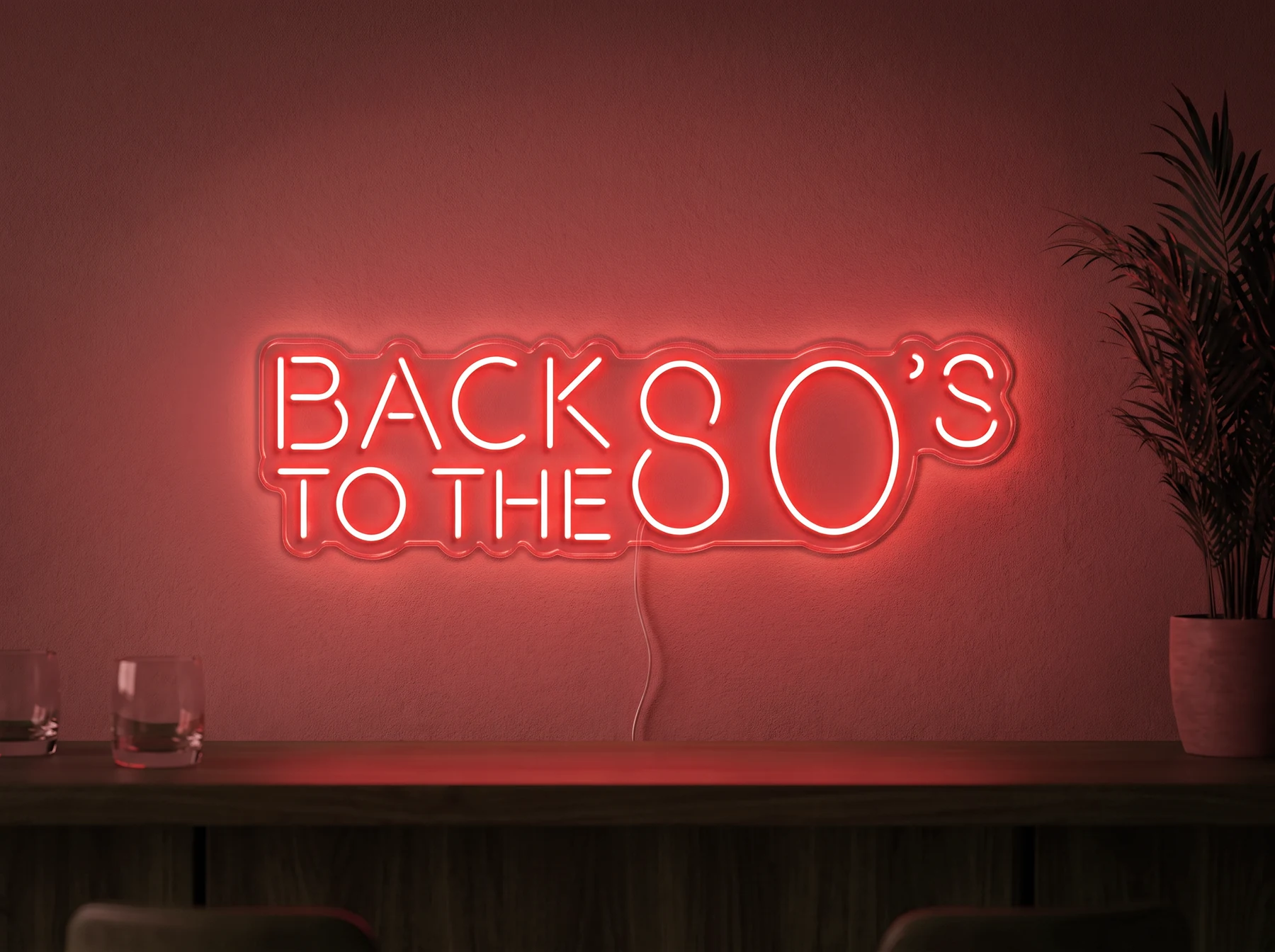 Neonskylt «Back to the 80s» i röd LED-neon, monterad på vägg