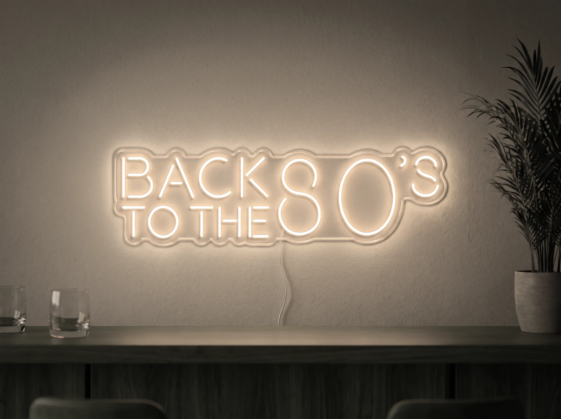 Neonskylt «Back to the 80s» i varmvit LED-neon, monterad på vägg