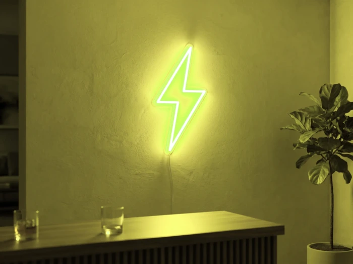 Neonskylt «Blixt» i gul LED-neon, monterad på vägg
