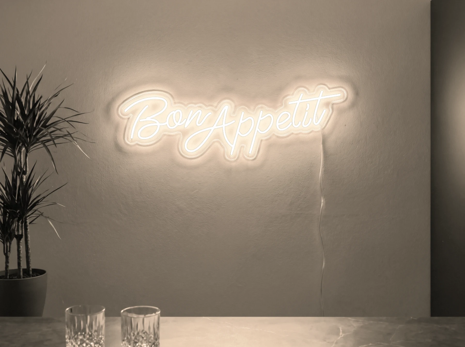 Neonskylt «Bon Appétit» i varmvit LED-neon, monterad på vägg