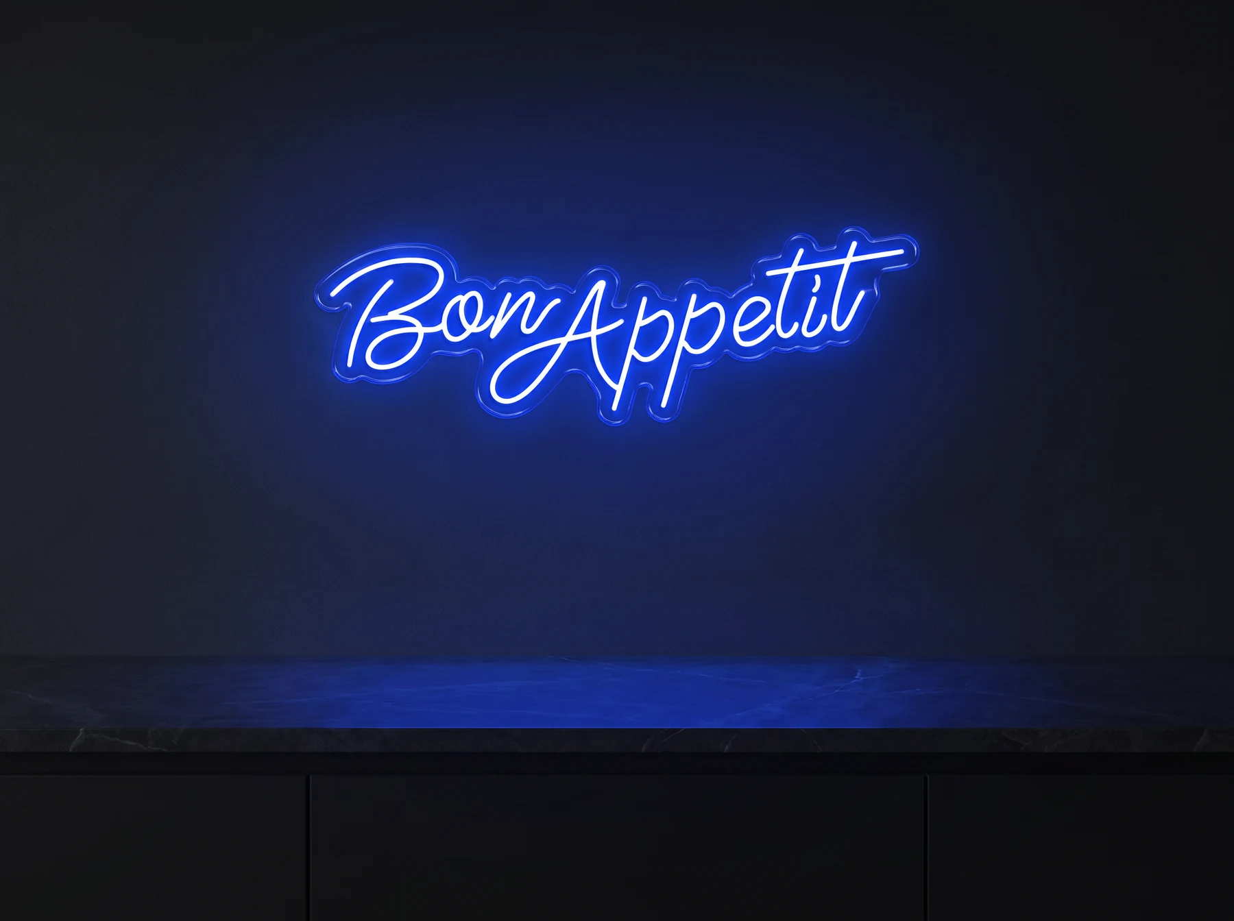 Neonskylt «Bon Appétit» — texten Bon Appétit i skrivstil, i LED-neon på vägg