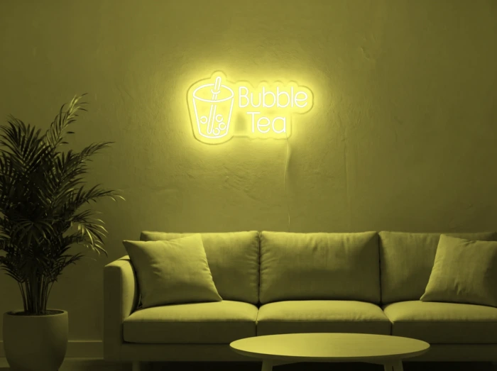 Neonskylt «Bubble Tea» i gul LED-neon, monterad på vägg