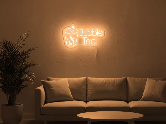 Neonskylt «Bubble Tea» i orange LED-neon, monterad på vägg