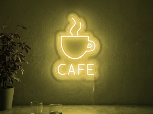 Neonskylt «Cafe» i gul LED-neon, monterad på vägg