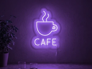 Neonskylt «Cafe» i lila LED-neon, monterad på vägg