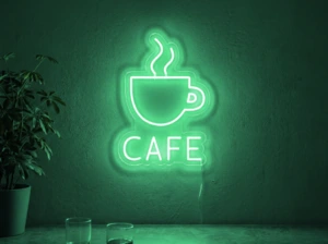 Neonskylt «Cafe» i mintgrön LED-neon, monterad på vägg