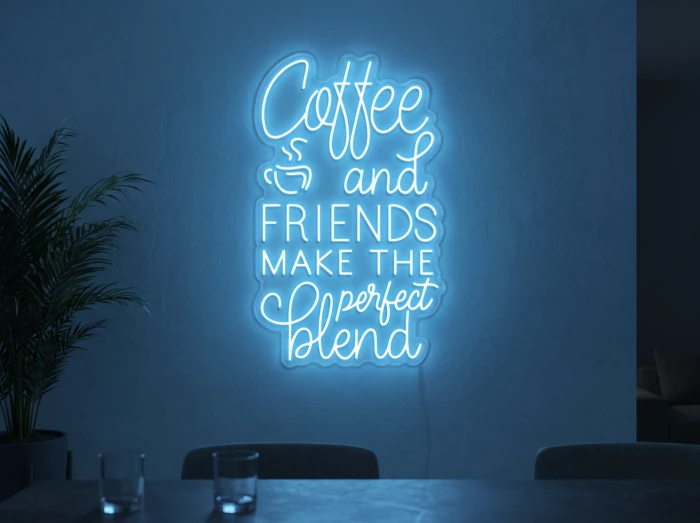 Neonskylt «Coffee and Friends» i isblå LED-neon, monterad på vägg