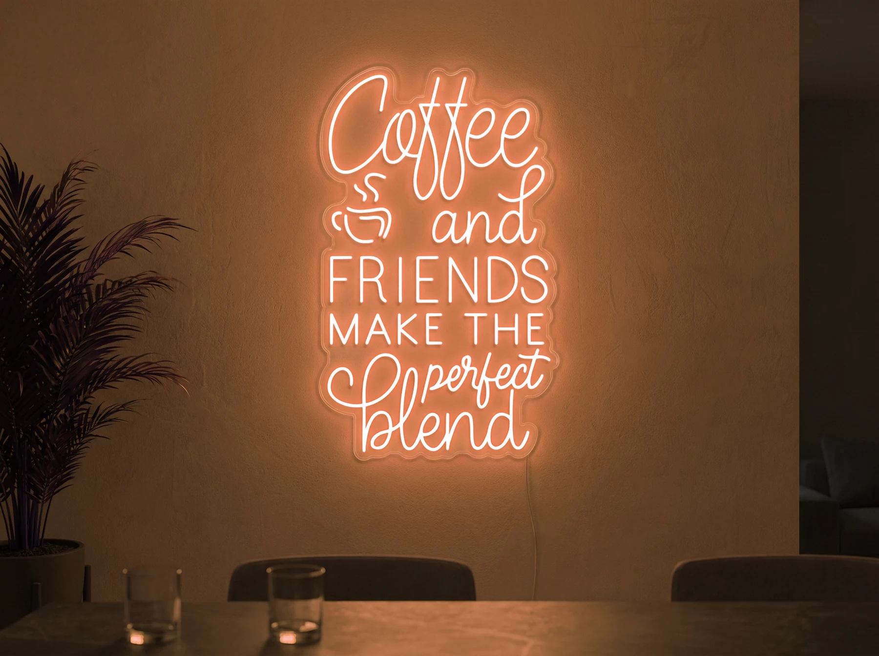 Neonskylt «Coffee and Friends» i orange LED-neon, monterad på vägg