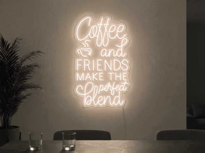 Neonskylt «Coffee and Friends» i varmvit LED-neon, monterad på vägg