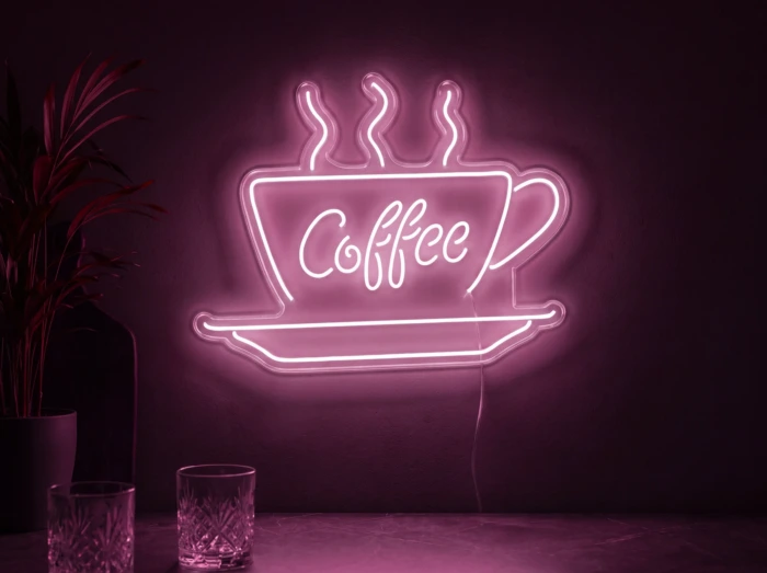 Neonskylt «Coffee» i rosa LED-neon, monterad på vägg