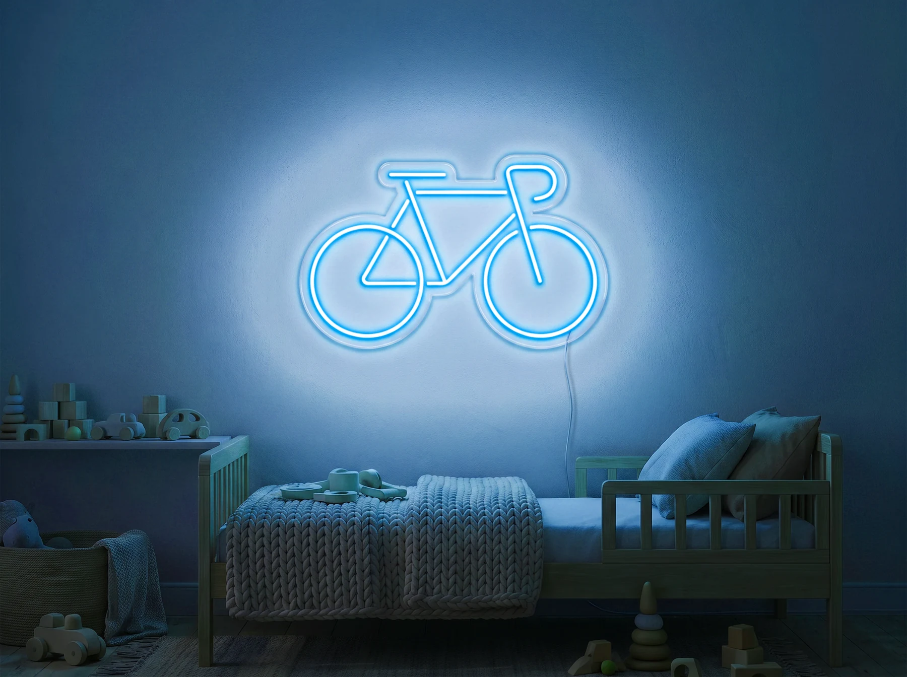 Neonskylt «Cykel» i isblå LED-neon, monterad på vägg