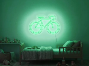 Neonskylt «Cykel» i mintgrön LED-neon, monterad på vägg