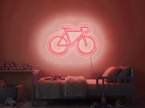 Neonskylt «Cykel» i röd LED-neon, monterad på vägg