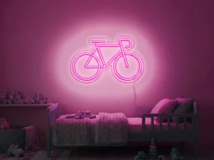 Neonskylt «Cykel» i rosa LED-neon, monterad på vägg