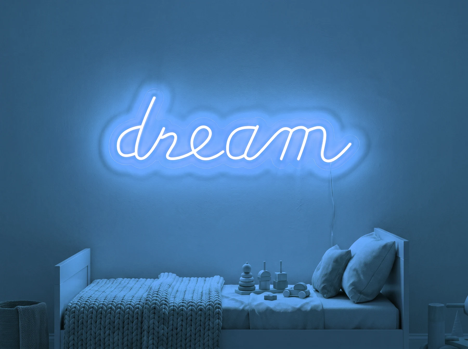 Neonskylt «Dream» i isblå LED-neon, monterad på vägg