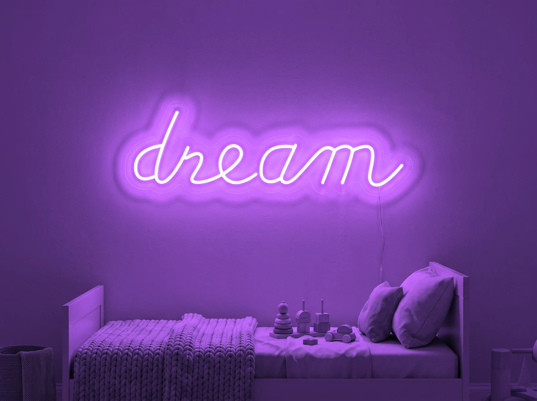 Neonskylt «Dream» i lila LED-neon, monterad på vägg