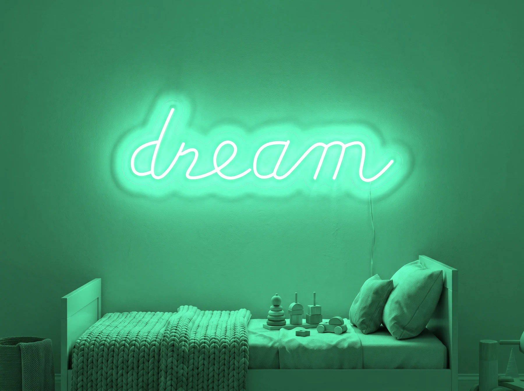 Neonskylt «Dream» i mintgrön LED-neon, monterad på vägg