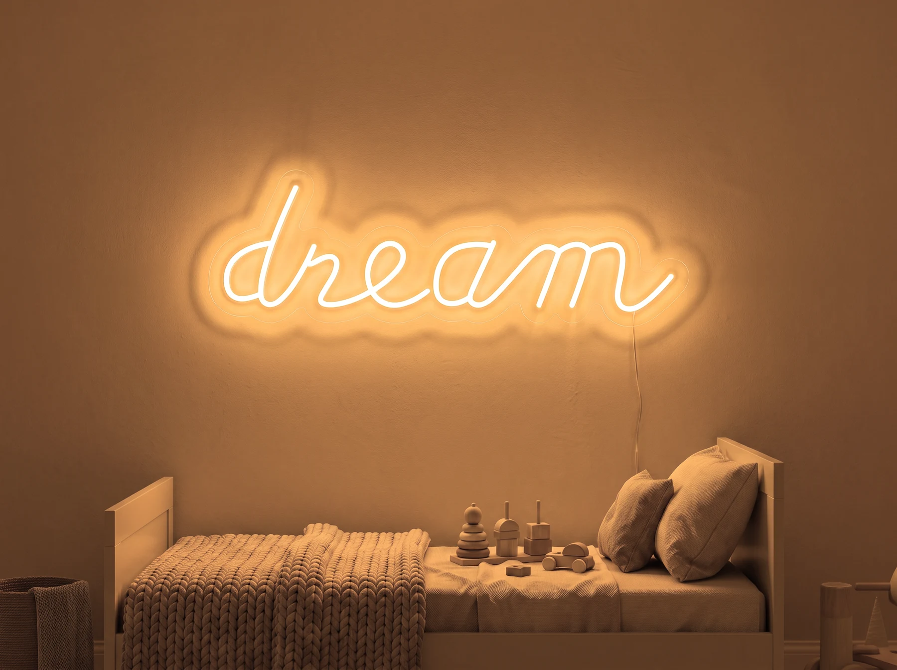 Neonskylt «Dream» i orange LED-neon, monterad på vägg