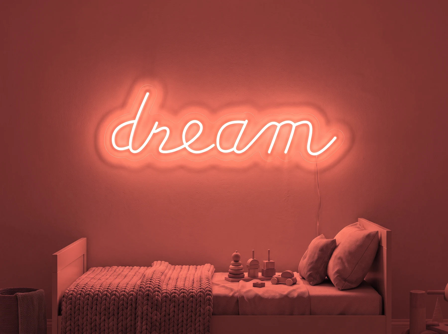 Neonskylt «Dream» i röd LED-neon, monterad på vägg