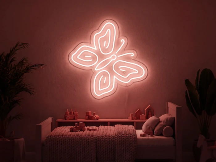 Neonskylt «Fjäril» i röd LED-neon, monterad på vägg
