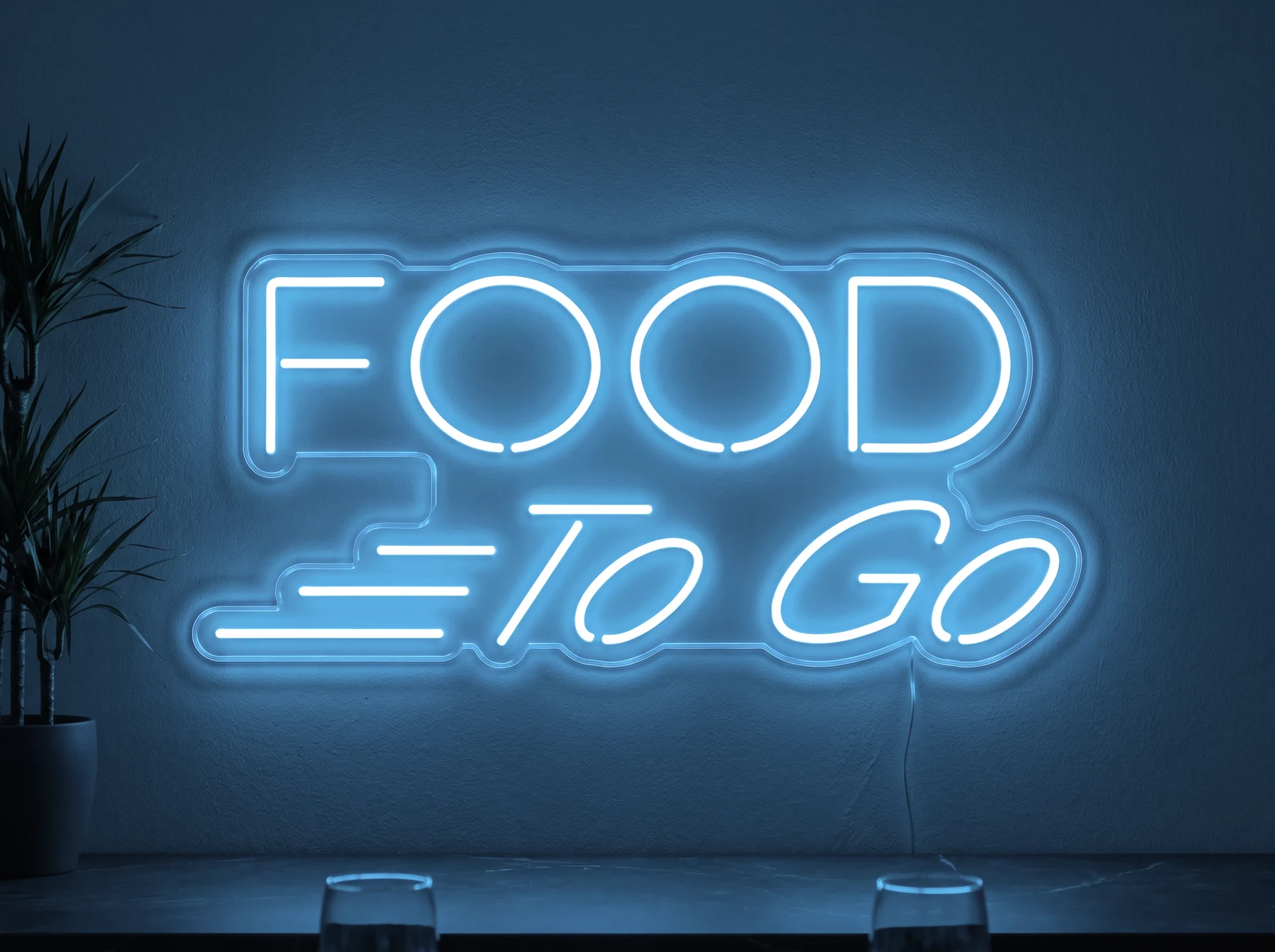 Neonskylt «Food To Go» i isblå LED-neon, monterad på vägg
