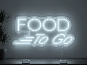 Neonskylt «Food To Go» i iskall vit LED-neon, monterad på vägg