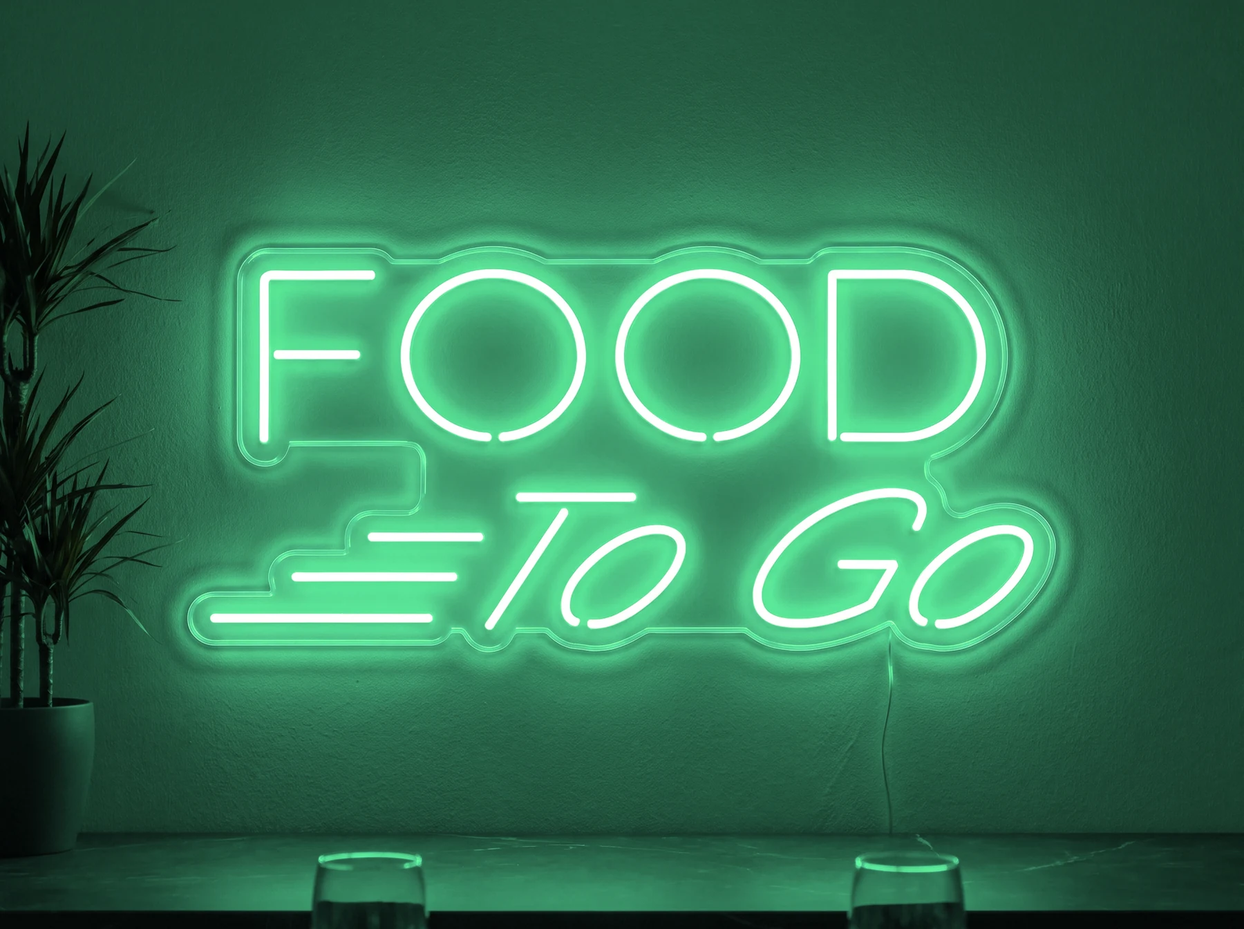 Neonskylt «Food To Go» i mintgrön LED-neon, monterad på vägg
