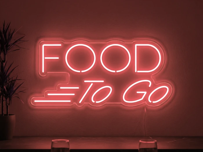 Neonskylt «Food To Go» i röd LED-neon, monterad på vägg