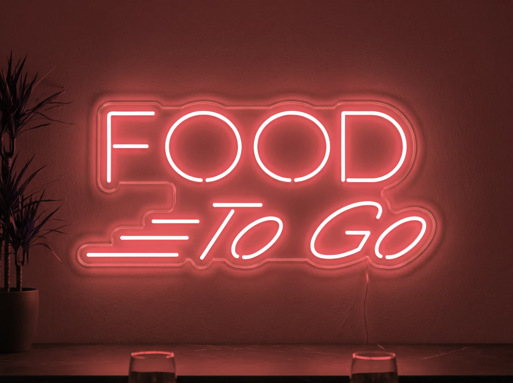 Neonskylt «Food To Go» i röd LED-neon, monterad på vägg