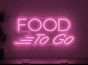 Neonskylt «Food To Go» i rosa LED-neon, monterad på vägg