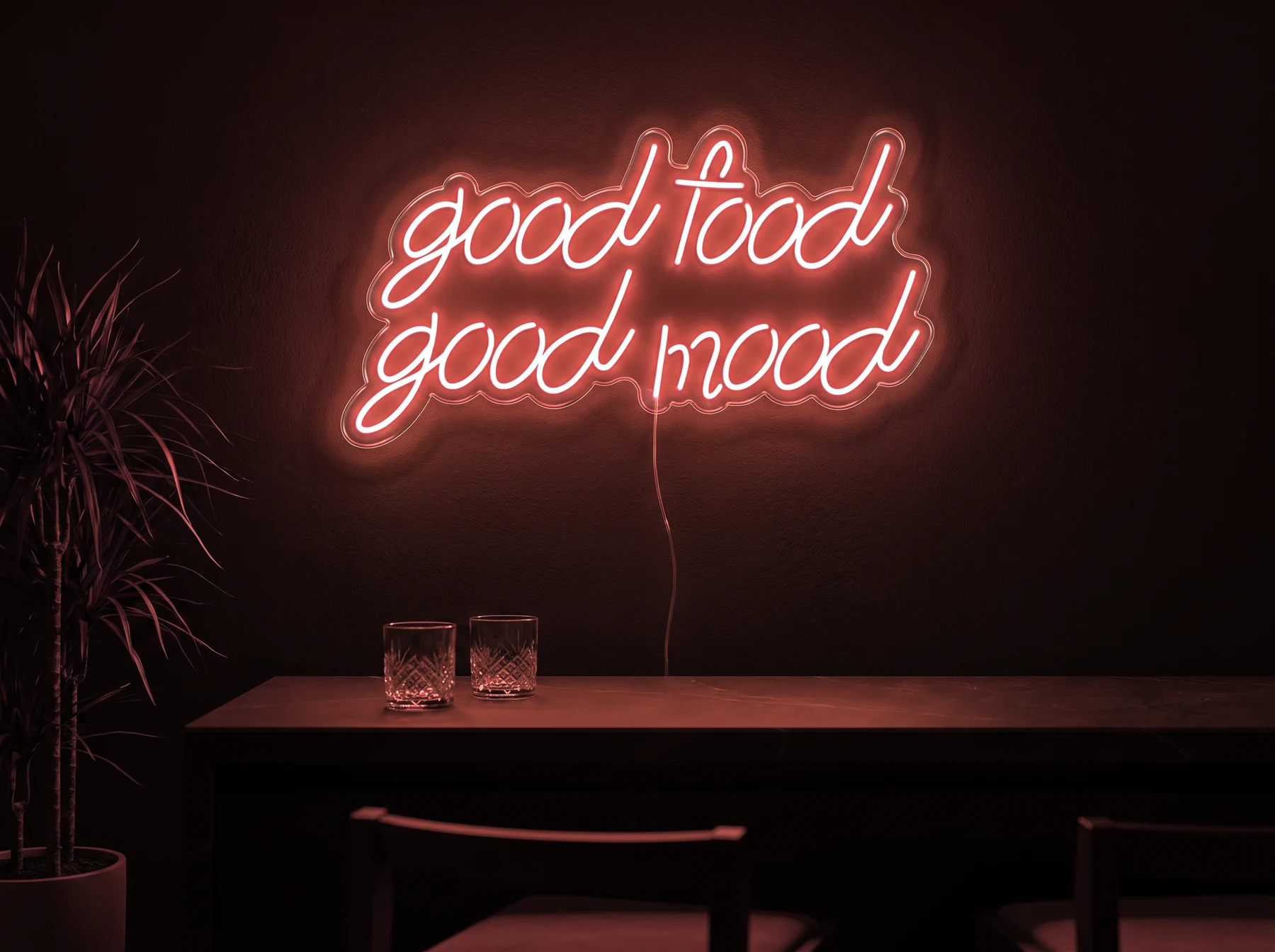 Neonskylt «Good Food Good Mood» i röd LED-neon, monterad på vägg