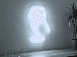Neonskylt «Hand med glas» i iskall vit LED-neon, monterad på vägg