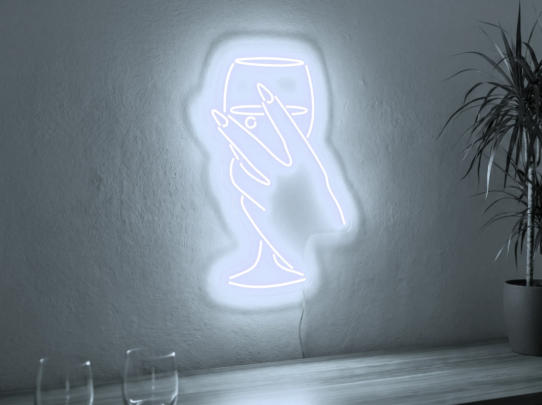 Neonskylt «Hand med glas» i iskall vit LED-neon, monterad på vägg