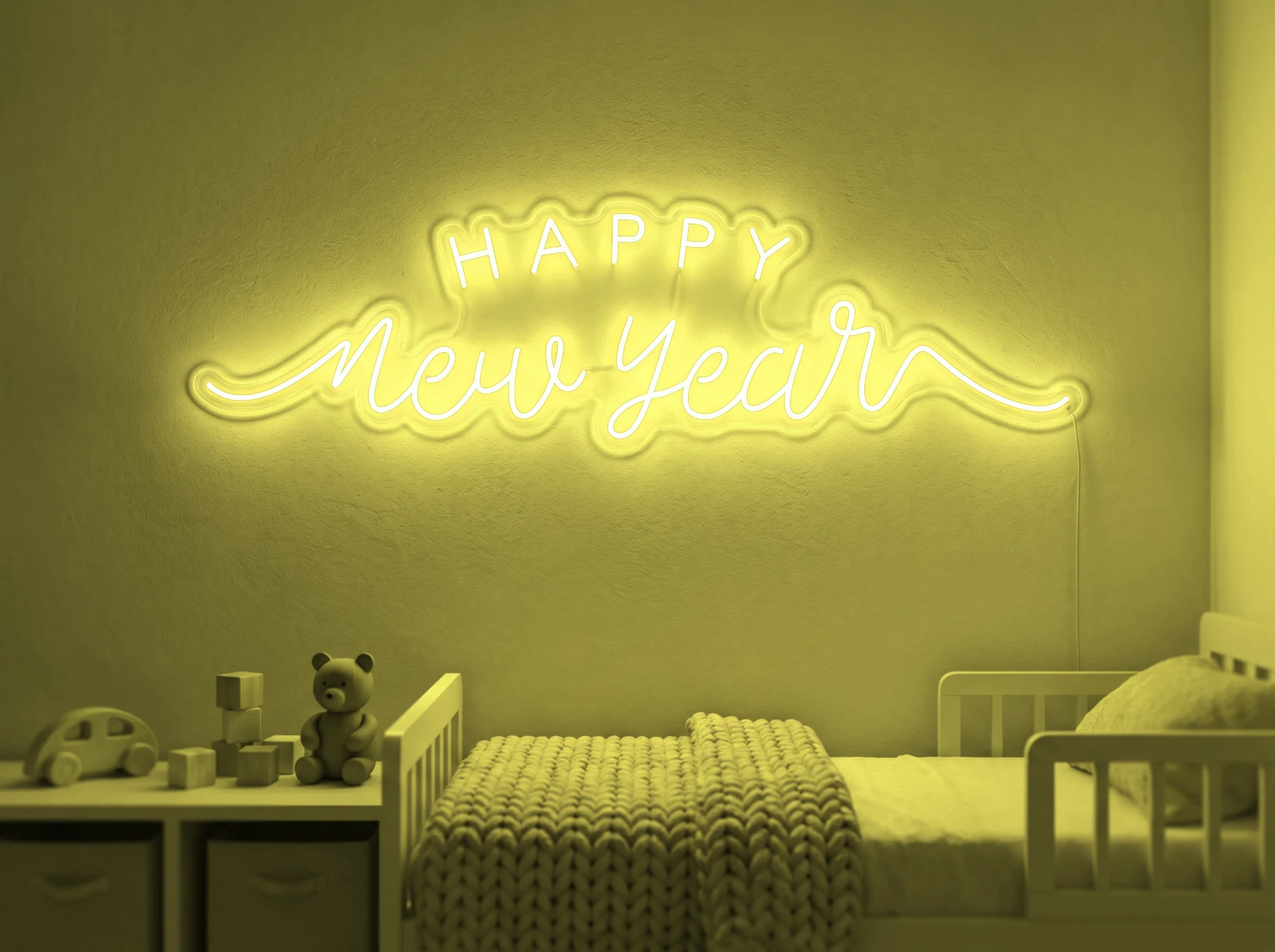 Neonskylt «Happy New Year» i gul LED-neon, monterad på vägg